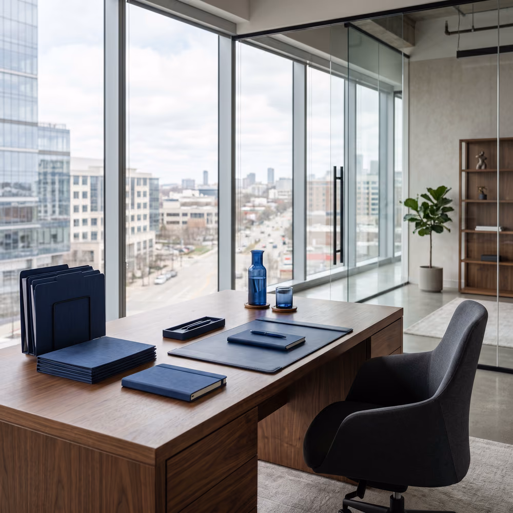 A modern office workspace with notebooks and a city view