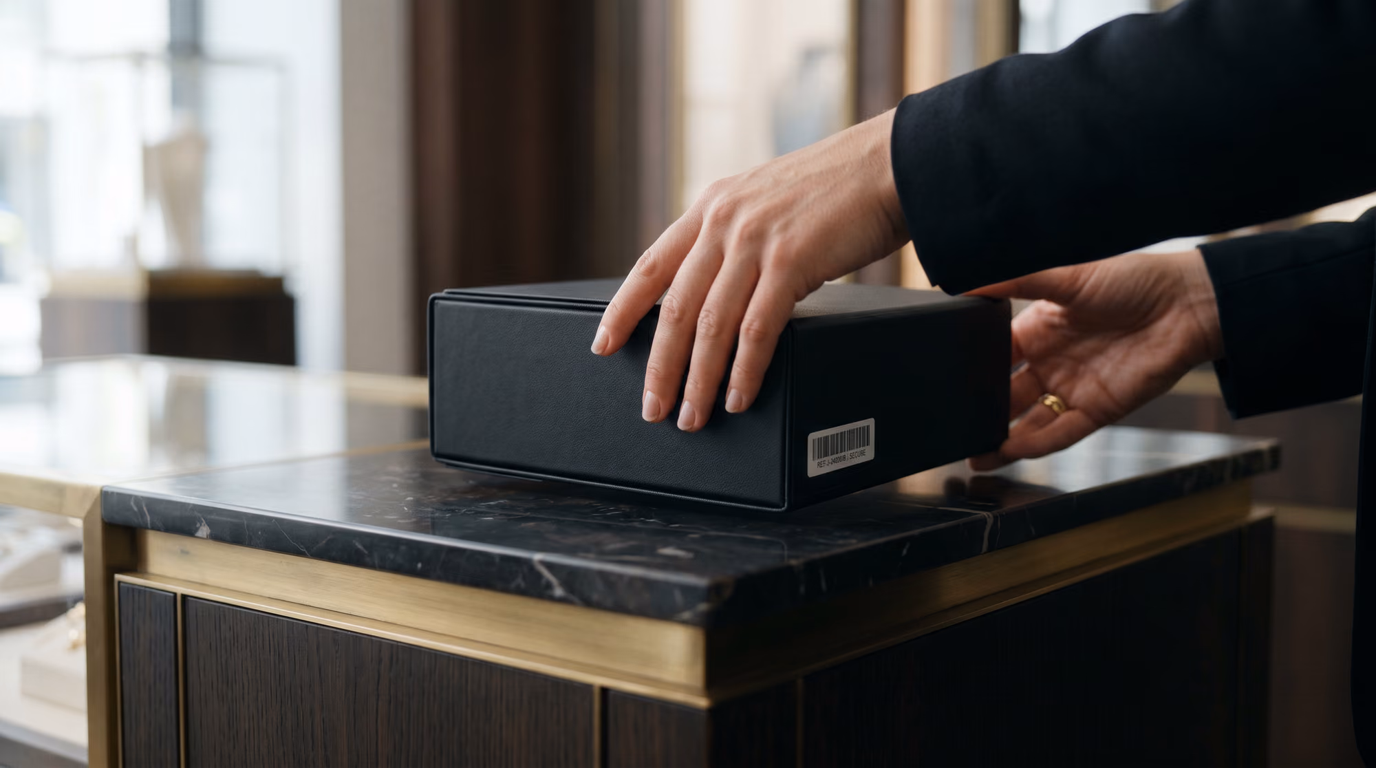 A specialist placing a sealed protective case on a counter
