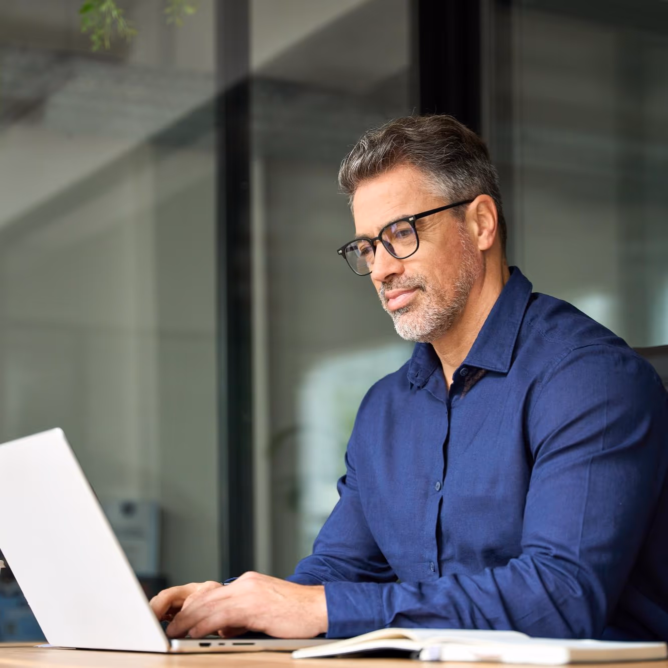 Business owner registering an account on a laptop