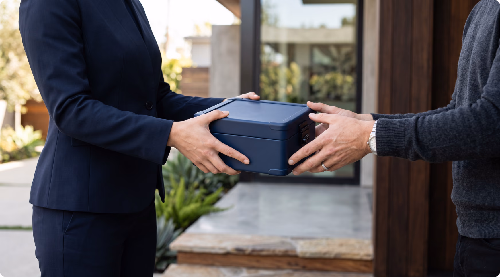 A briefcase of valuables being handed over at a residence