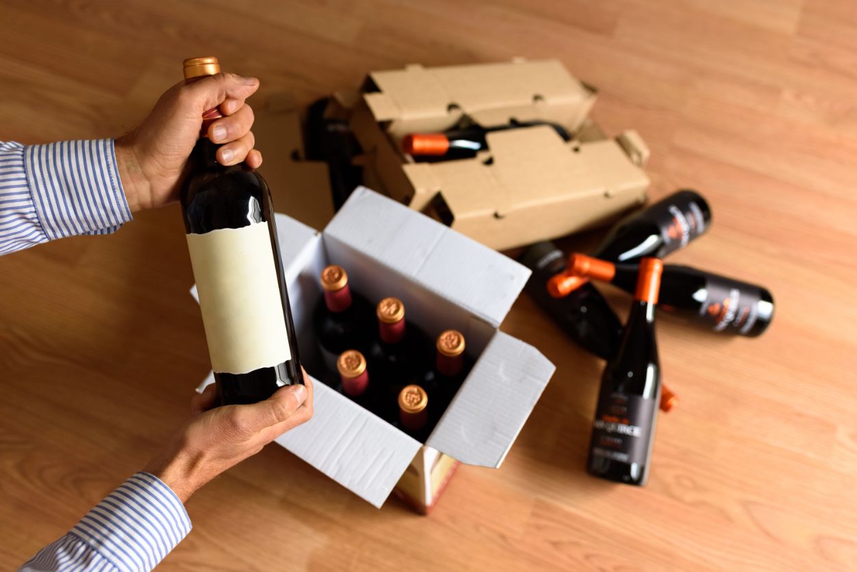 bottles of red wine in wooden box