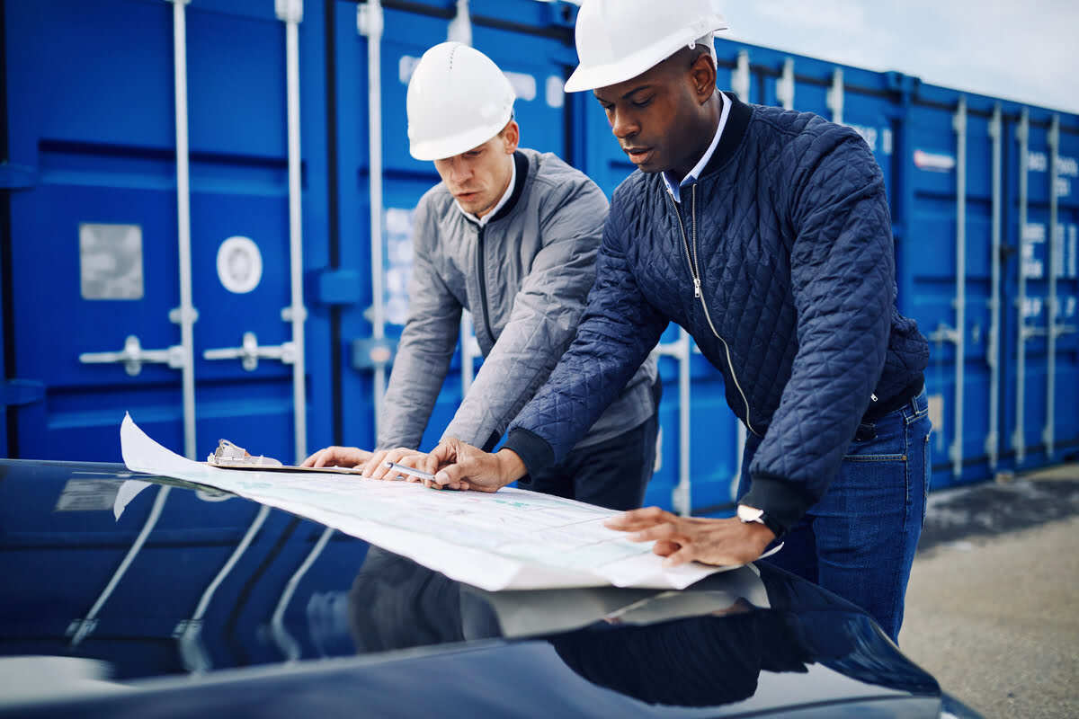 two men discussing logistics